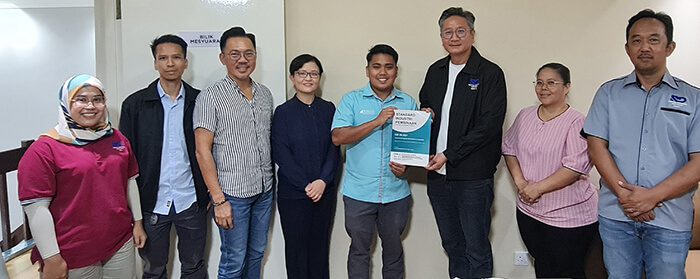 Group of people holding book