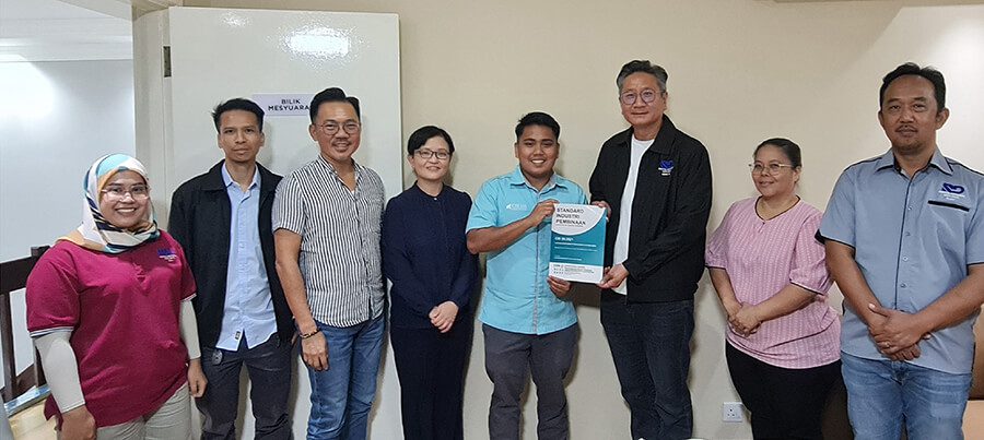 Group of people holding a book