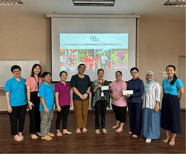 Group of women holding certificate